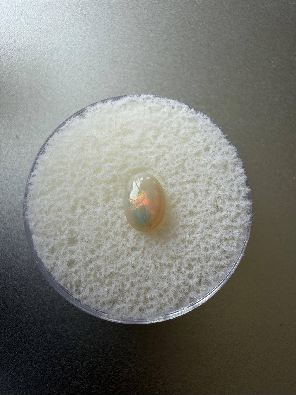Natural opal cabochon gemstone, red blue green fire splashes, 7x5 mm